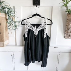 Lace trimmed shirt with cut out shoulders